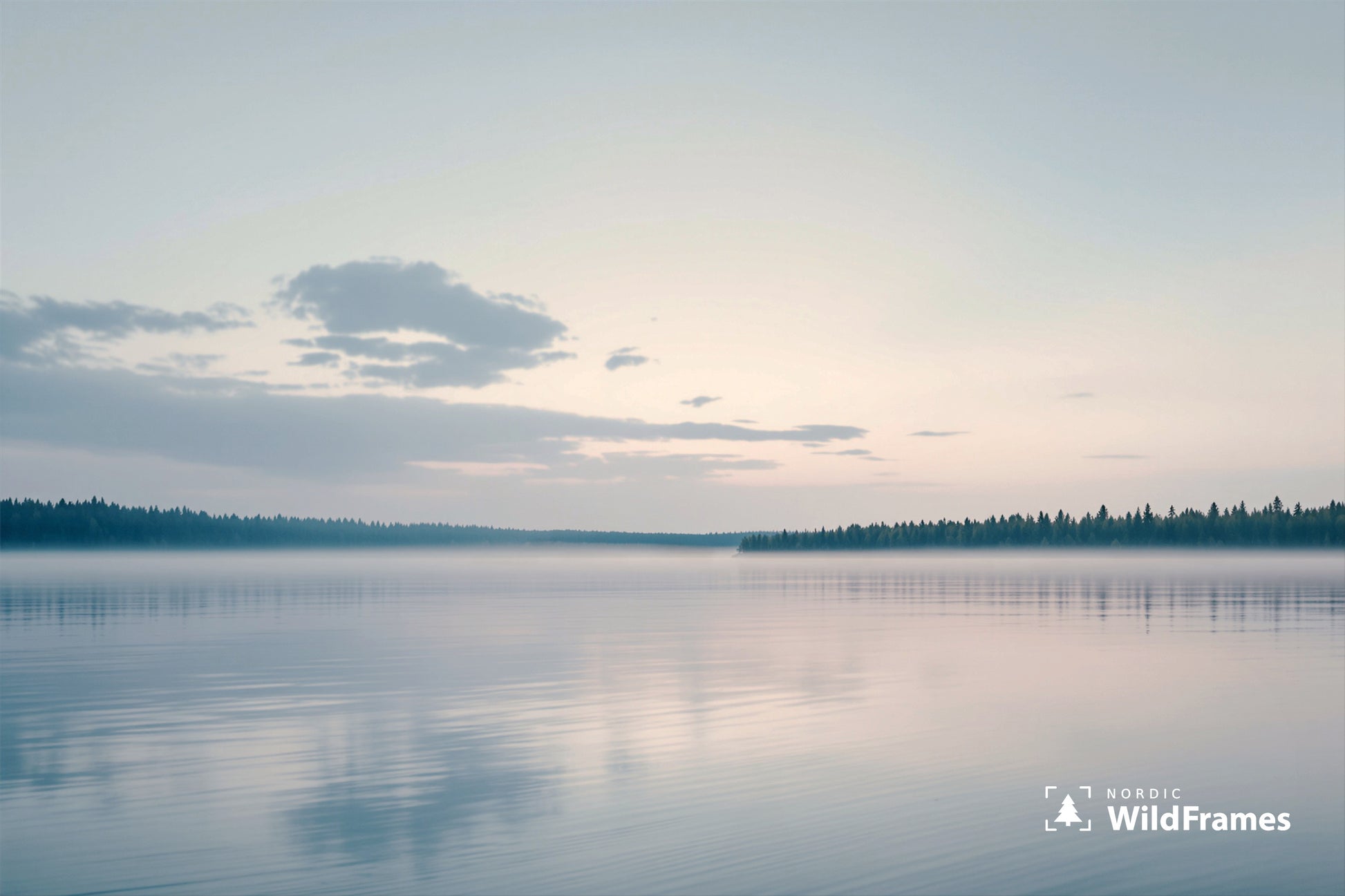 Tranquil lake at dusk with pastel sky, forest shorelines and mist reflected on still water, Finland